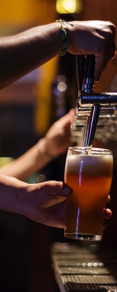 person holding drinking glass