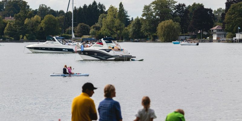 people riding on boat on water during daytime
